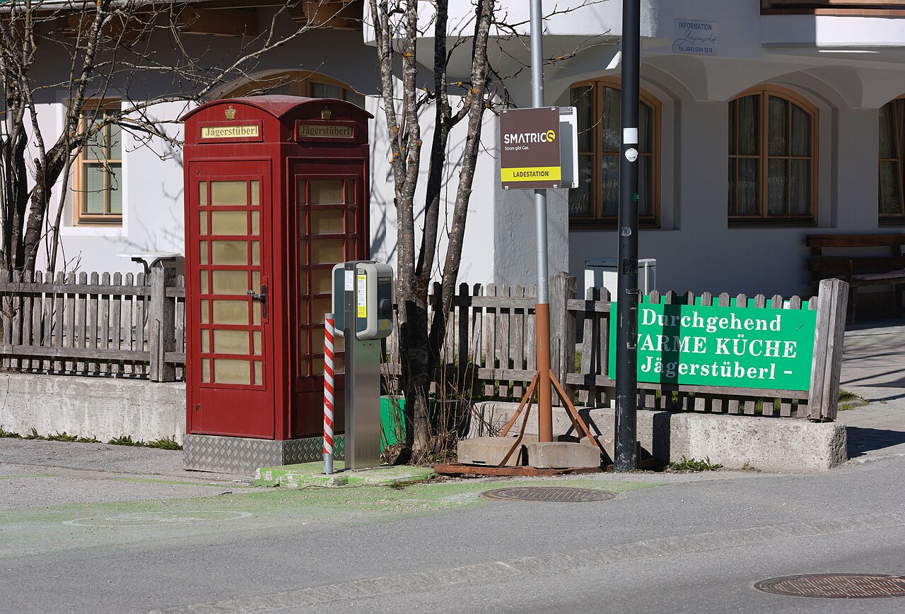 Free-standing charging station beside a road in an Austrian alpine village
