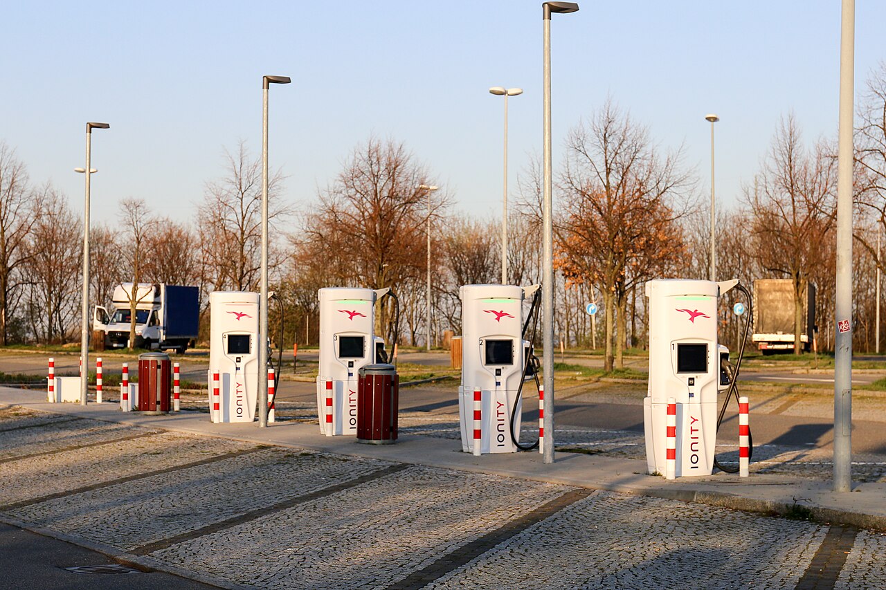 Bank of rapid charging units under a canopy at a German motorway service area